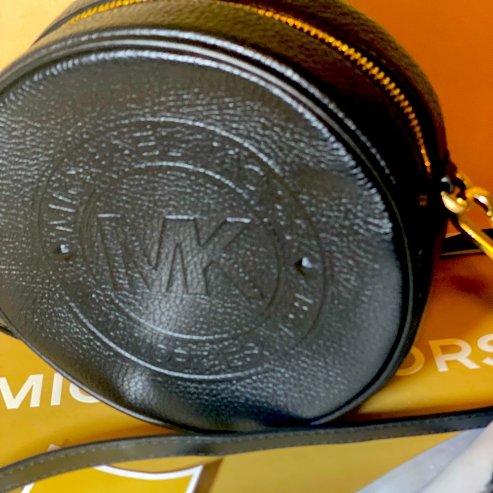 Michael Kors Fulton Logo Debossed Leather canteen crossbody bag.